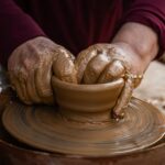 Close-up of hands shaping clay on a pottery wheel in İznik, Bursa, Türkiye.